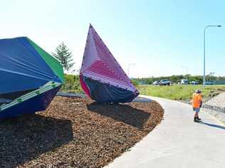 UNDER WRAPS: Graffiti on art installations at the entrance to the newly opened Bells Creek Arterial Road has been covered up. Picture: John McCutcheon