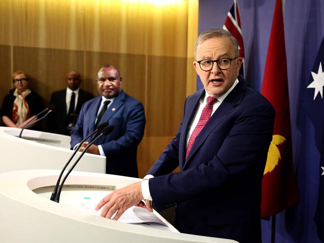 Australian Prime Minister Anthony Albanese (R) speaks next to Papua New Guinea's Prime Minister James Marape during a press conference in Sydney on December 12, 2024.  (Photo by David GRAY / AFP)