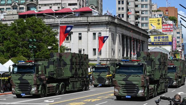 Taiwanese military vehicles take part in a national day parade in front of the Presidential Palace in Taipei this month. Picture: AFP