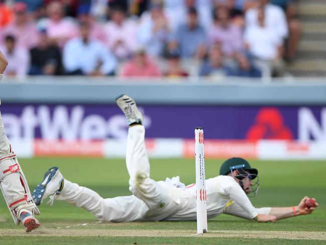 LONDON, ENGLAND - AUGUST 15: England batsman Rory Burns looks on as Cameron Bancroft dives to catch him out during day two of the 2nd Test Match between England and Australia at Lord's Cricket Ground on August 15, 2019 in London, England. (Photo by Stu Forster/Getty Images)