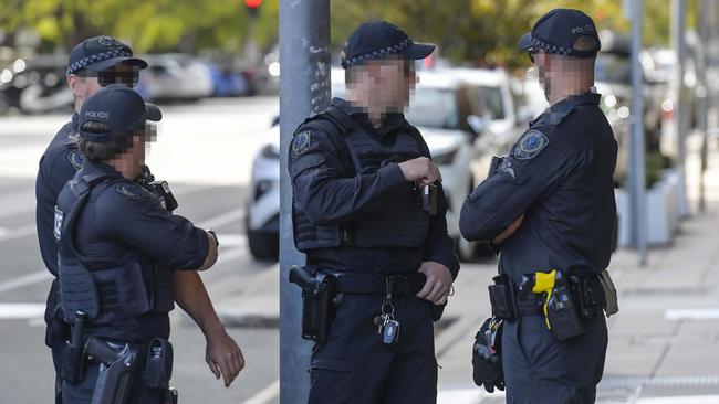 Police outside Adelaide Magistrates Court for the appearance of the Hells Angels.