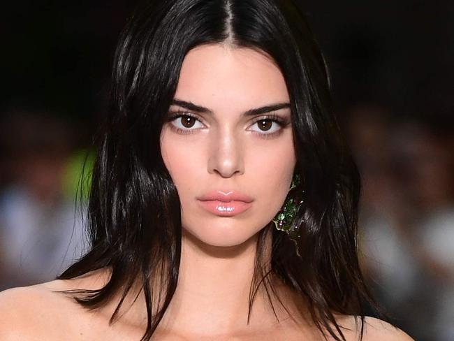 US model Kendall Jenner presents a creation by Versace during the men & women's spring/summer 2019 collection fashion show in Milan, on June 16, 2018. / AFP PHOTO / MIGUEL MEDINA