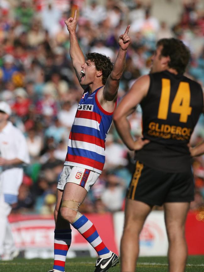 Central’s Chris Gowans celebrates as Glenelg’s Ty Allen feels the pain in 2008.