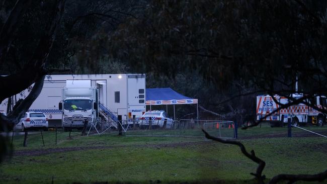 Police at the scene of the shooting in Barnawartha North, on the Victorian side of the Murray River. Picture: Simon Dallinger