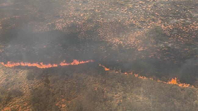 Volunteers and staff from Bushfires NT continue to battle out-of-control blazes in and around the lytwelepenty/Davenport Ranges National Park in Davenport. The national park will remain closed until at least November 4 as the fire is brought under control. Picture: Bushfires NT.