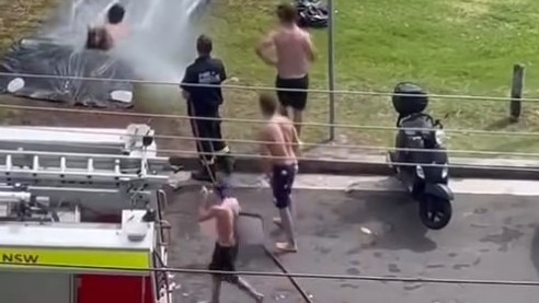 NSW Fire and Rescue helps out with the Australia Day slip and slide at Freshwater.