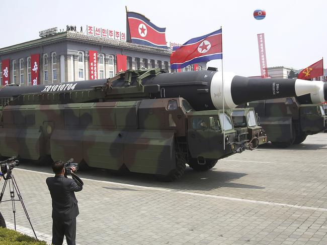 A North Korean KN-08 Intercontinental Ballistic Missile (ICMB) is paraded across Kim Il-sung Square during Saturday’s military parade in Pyongyang. Picture: Wong Maye-E/AP