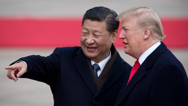 China's President Xi Jinping (L) and US President Donald Trump attend a welcome ceremony at the Great Hall of the People in Beijing in 2017.