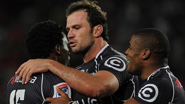 JOHANNESBURG, SOUTH AFRICA - APRIL 12: Lwazi Mvovo celebrating his try with Lourense Adrianse,Bismarck du Plessis and Sibusiso Sithole during the Super Rugby match between Lions and Cell C Sharks at Ellis Park on April 12, 2014 in Johannesburg, South Africa. (Photo by Gallo Images)