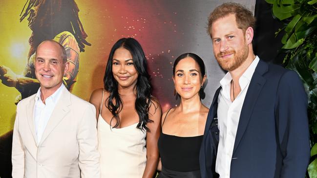 Harry and Meghan, pictured with Brian and Tracy Robbins, visited Kingston for the premiere of Bob Marley: One Love in January. Picture: Jason Koerner/Getty Images for Paramount Pictures