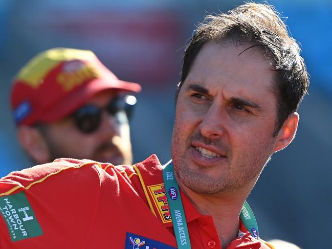 HOBART, AUSTRALIA - AUGUST 27: Cameron Joyce Head coach of the Suns talks to the players during the round one AFLW match between the North Melbourne Kangaroos and the Gold Coast Suns at Blundstone Arena on August 27, 2022 in Hobart, Australia. (Photo by Steve Bell/Getty Images)