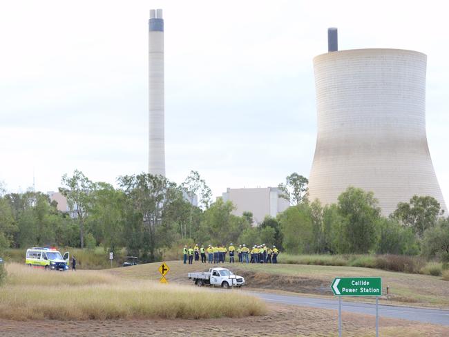 Workers from the Callide Power Station outside the site after a fire today. Photo - William Debois