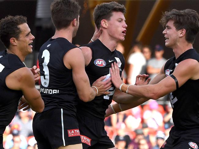 Sam Walsh of the Blues (centre) reacts after kicking a goal during  the Round 4 AFL match between the Gold Coast Suns and the Carlton Blues at Metricon Stadium on the Gold Coast, Sunday, April 14, 2019. (AAP Image/Dave Hunt) NO ARCHIVING, EDITORIAL USE ONLY