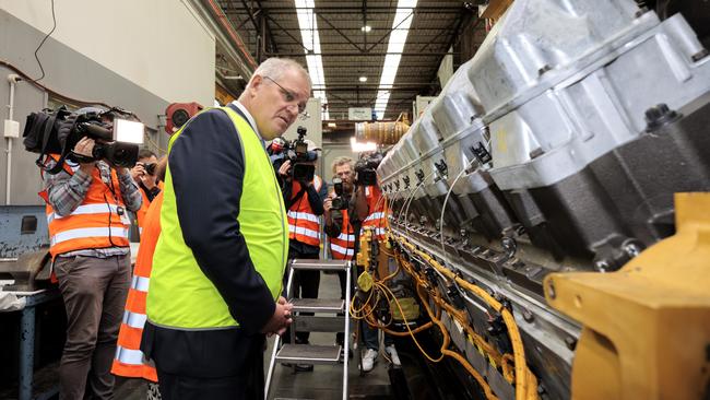 Prime Minister Scott Morrison poses for the cameras at William Adams CAT in Clayton. Picture: David Geraghty.