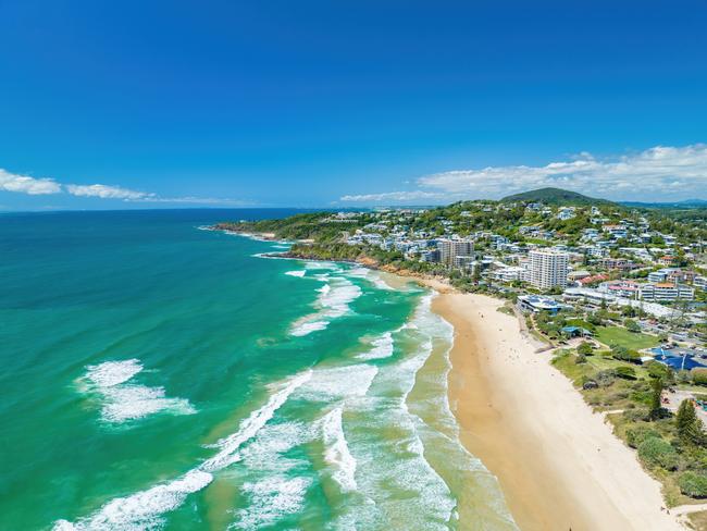 An aerial of the foamy waves of the ocean hitting the sandy shore in Coolum, Sunshine Coast QLD.Escape 2 February 2025NewsPhoto - iStock