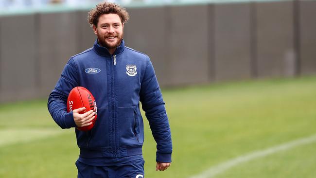 Jack Steven walks laps at Geelong training. Picture: Alison Wynd