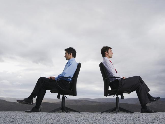 Two men sitting opposite each other for business culture clash