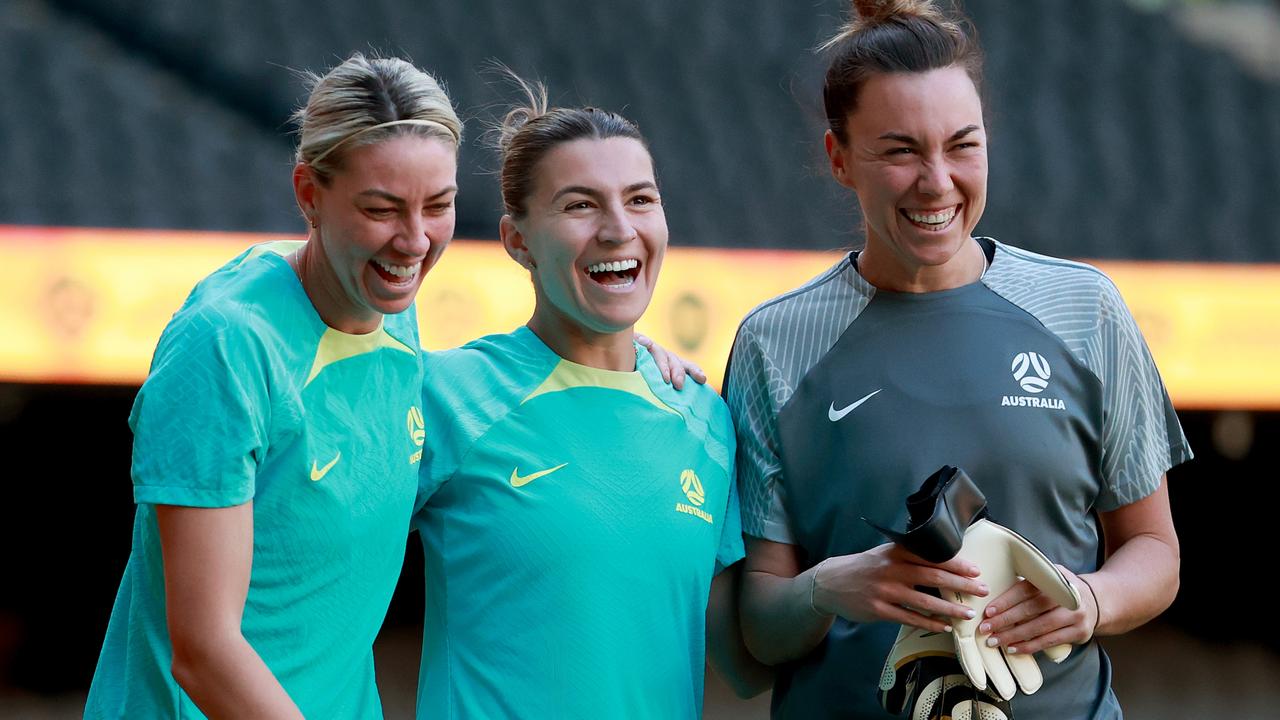 Alanna Kennedy (left) shares a laugh with fellow defensive stalwarts Steph Catley (centre) and Mackenzie Arnold before the Matildas’ match against Uzbekistan in Melbourne. Picture: Kelly Defina / Getty Images