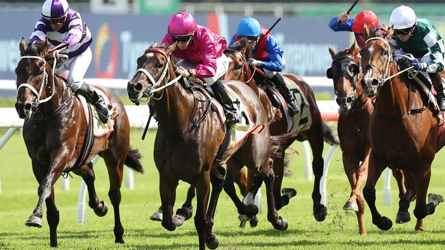 Fangirl (cerise) goes back-to-back in the Group 2 Apollo Stakes at Randwick. Picture: Getty Images