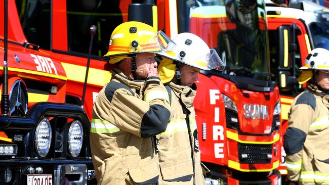 Firefighters at Kemp Place Fire Station in Brisbane remember their fallen colleague during International Firefighters Day on Thursday. Picture: David Clark