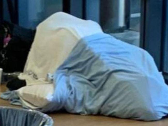 A patient on the floor sleeping at the Gold Coast University Hospital Emergency Department