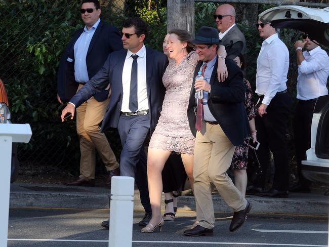 People leaving the Melbourne Cup Day at Eagle Farm. Picture: AAP/Richard Gosling