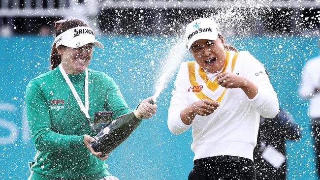 Minjee (right) is doused with champagne by compatriot Hannah Green during the final round of the BMW Ladies Championship in South Korea. Picture: Chung Sung-Jun/Getty Images