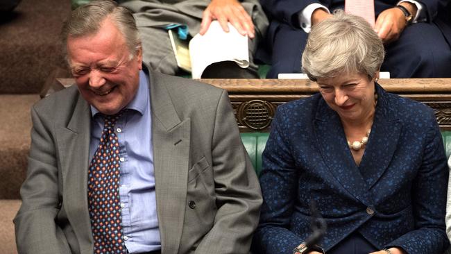 Former prime minister Theresa May and rebel Tory Kenneth Clarke, former Chancellor, share a joke during the debate. Mr Clarke will stand down at the next election after having the whip removed.