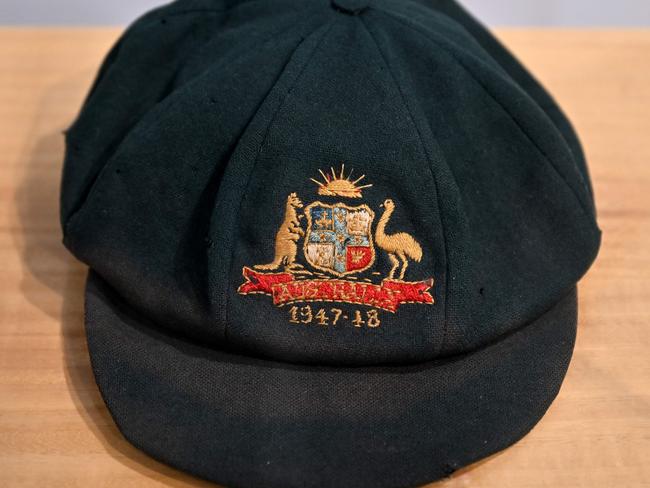 A cap worn by Australia's greatest cricket legend Don Bradman is on display at an auction house Bonhams in Sydney on December 2, 2024. The cap will be auctioned in Sydney on December 3, 2024, with the tattered "baggy green" expected to fetch as much as 260,000 USD. (Photo by Saeed KHAN / AFP)