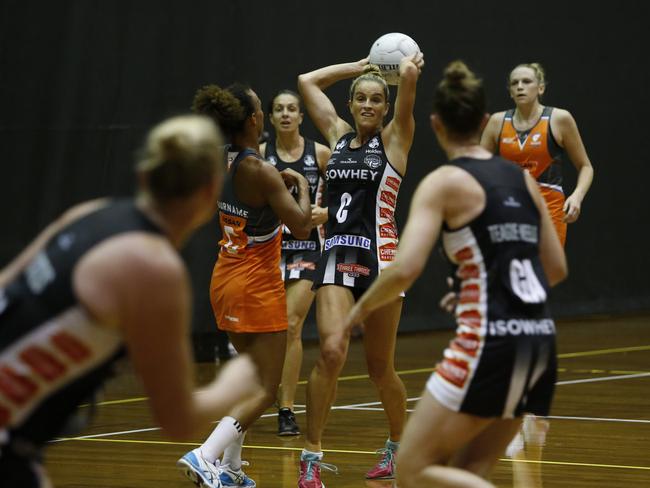 A netball friendly between the Giants (orange) and the Magpies (black) at Homebush.