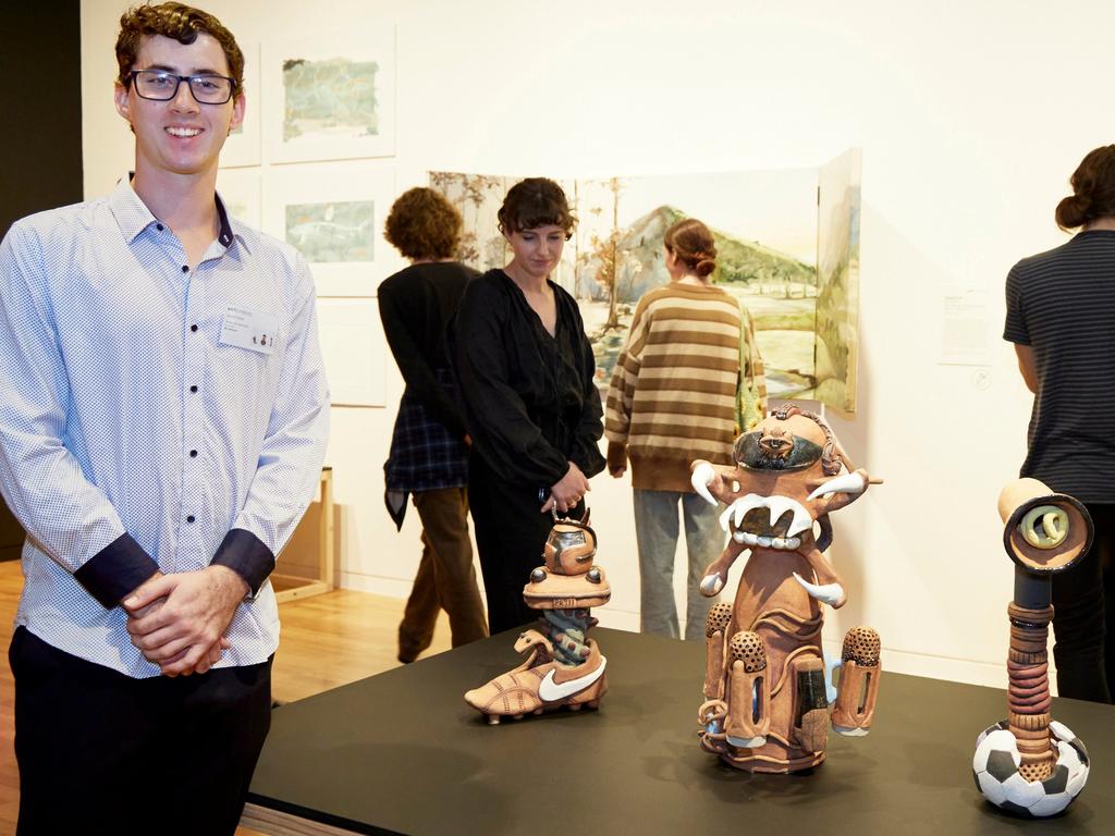 Jayden Peter, with his sculpture works, 'My sentinels'. Picture: Mim Stirling