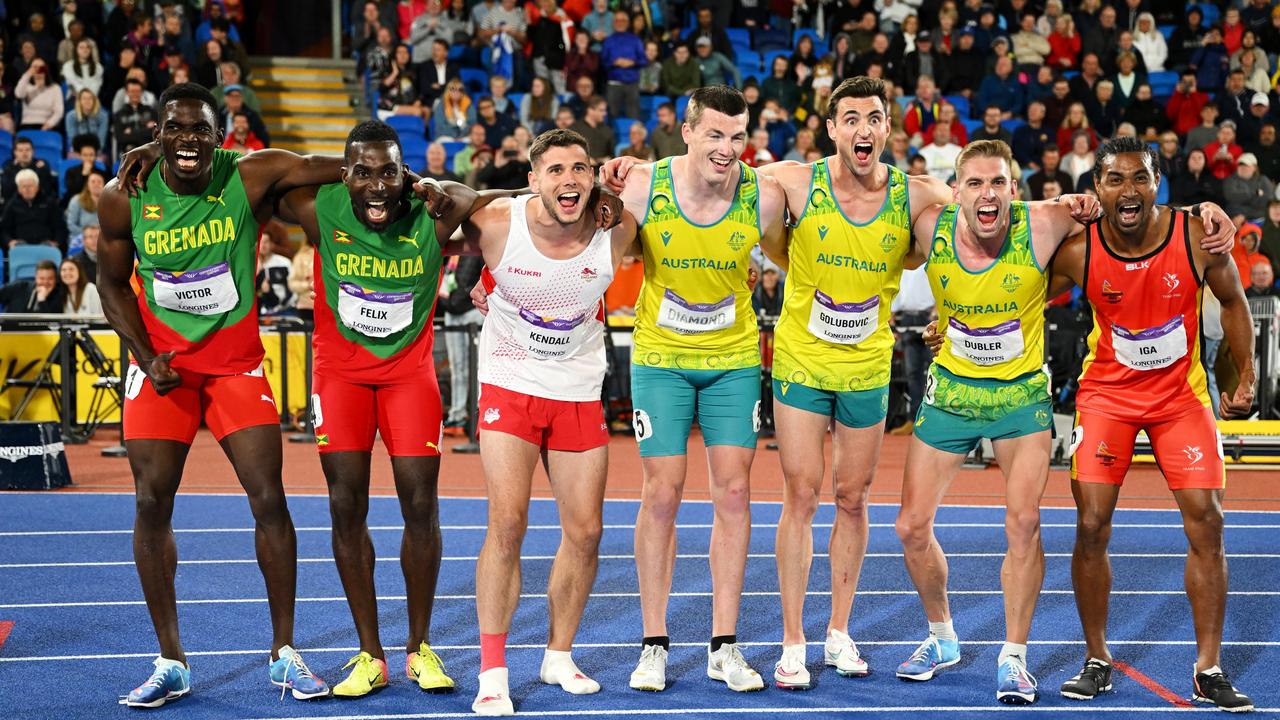 Lindon Victor and Kurt Felix of Team Grenada, Harry Kendall of Team England, Alec Diamond, Daniel Golubovic and Cedric Dubler of Team Australia and Karo Iga of Team Papua New Guinea celebrate at the end of their ten events. Photo by David Ramos/Getty Images.