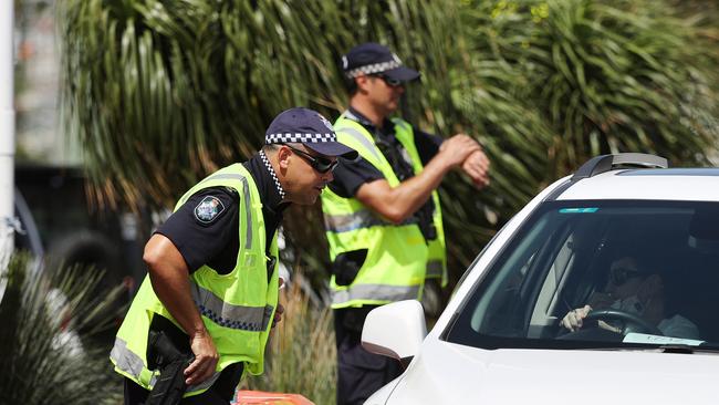 Police at the Queensland border in Griffith Street, Coolangatta. Picture: NIGEL HALLETT