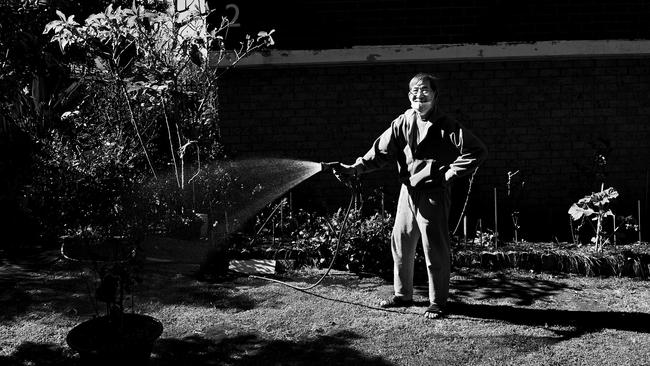 Quang Nguyen, 75, waters his garden in Cabramatta in one of the LGA most affected by the Delta outbreak. Photo Jeremy Piper