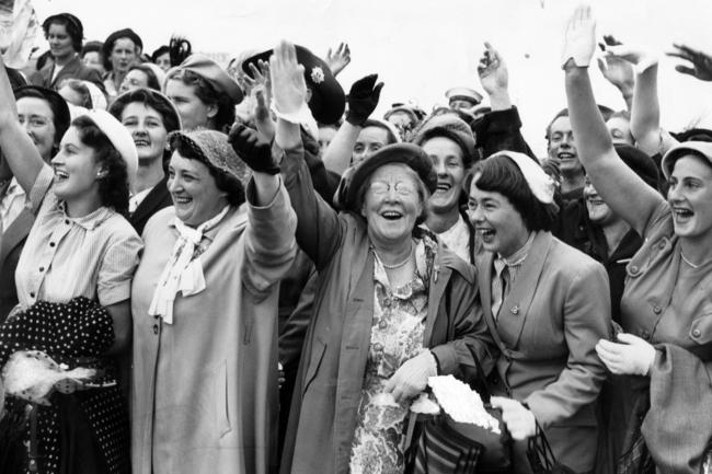 Ex-service women wave to the Queen as she passes Hobart’s Domain in 1954.