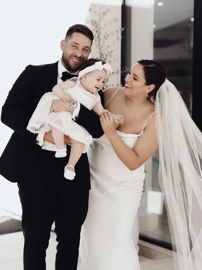 Leah Itsines and Mitch Caon at their wedding with their baby girl Gigi. Picture: Instagram