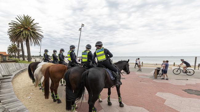 Police patrols are seen at St Kilda beach. Picture: NCA NewsWire / Daniel Pockett