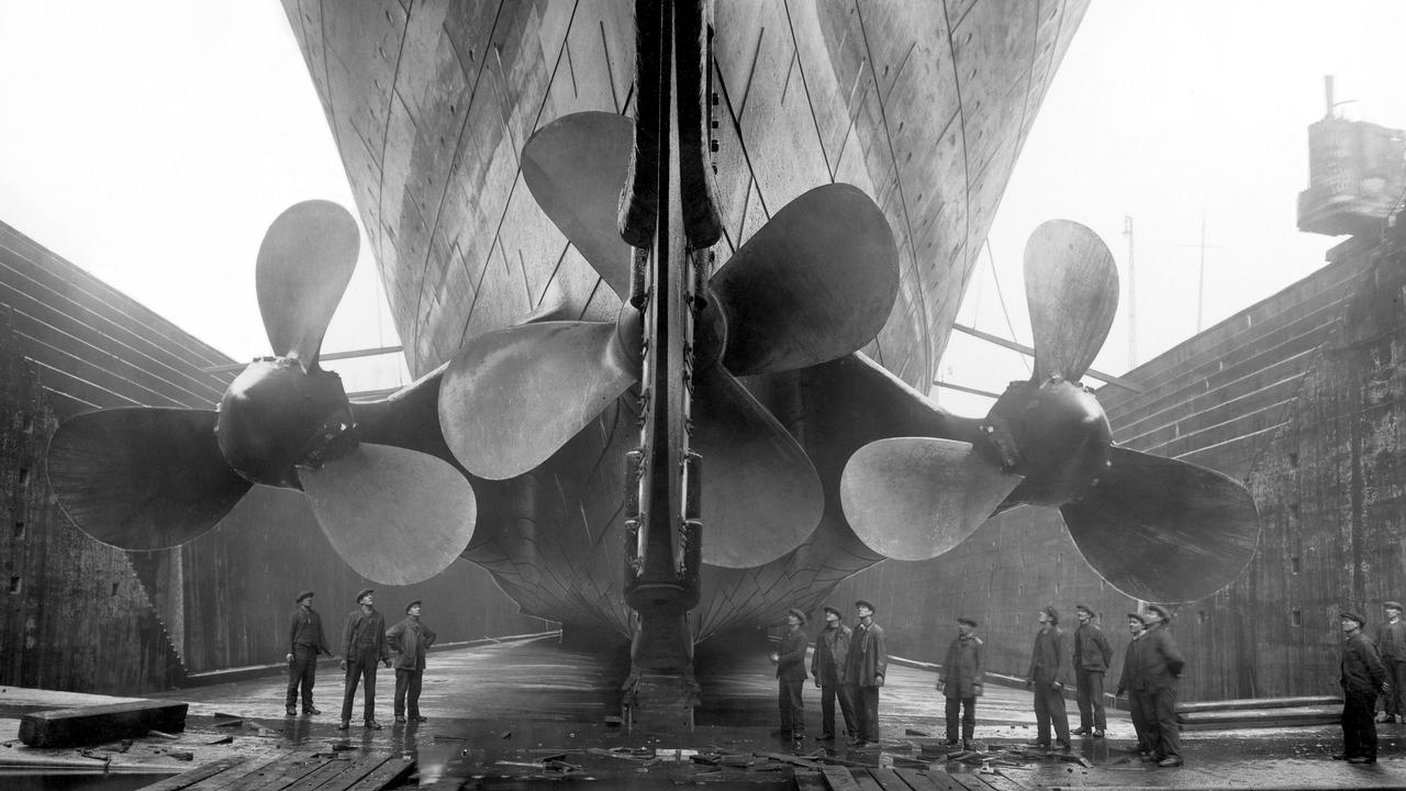 Vintage maritime history photo of the RMS Titanics propellers as the mighty ship sits in dry dock.