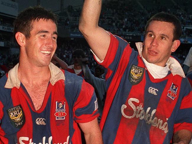 Brothers Andrew (L) and Matthew Johns do lap of honour after Newcastle defeated Manly in 1997 ARL grand final at SFS in Sydney. Picture: Andrew Darby