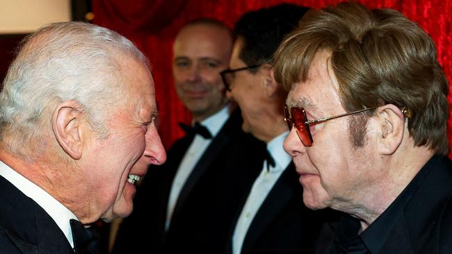 Britain's King Charles III meets Elton John as he attends the Royal Variety Performance at the Royal Albert Hall in London on November 22, 2024. The Royal Variety Performance takes place every year in aid of the Royal Variety Charity. The money raised from the show helps hundreds of entertainers throughout the UK, who need help and assistance. (Photo by Toby Melville / POOL / AFP)