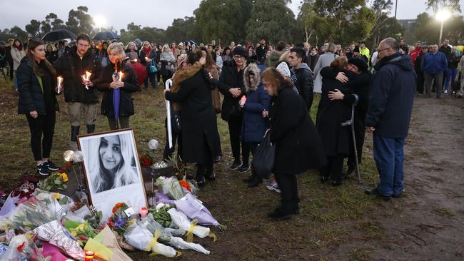 Mourners pay their respects to family members in Royal Park. Picture: Getty Images