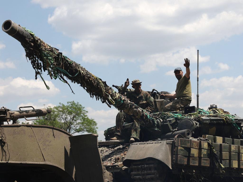 Ukrainian troops stand on a tank near Severodonetsk where Russian and Ukrainian troops have been locked in battle for weeks. Picture: AFP