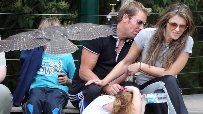 Cricket great Shane Warne was known for his flight of the ball but this day he and then girlfriend Liz Hurley had to dodge flapping wings during a Spirits of the Sky bird of prey show at Healesville Sanctuary. Picture: Alex Coppel