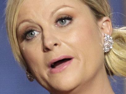 This image released by NBC shows co-hosts Tina Fey, left, and Amy Poehler on stage during the 70th Annual Golden Globe Awards held at the Beverly Hilton Hotel on Sunday, Jan. 13, 2013, in Beverly Hills, Calif. (AP Photo/NBC, Paul Drinkwater)