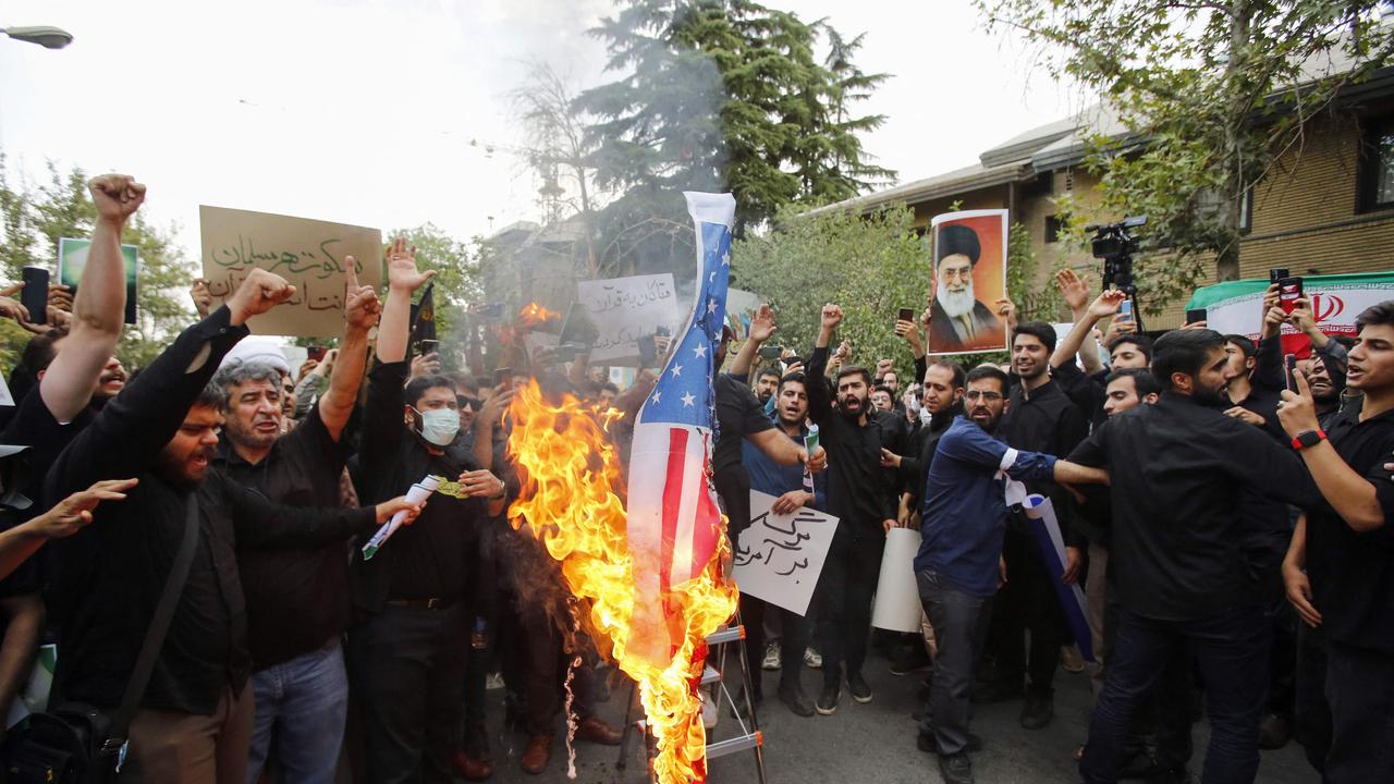 Iranian students burn a US flag during a demonstration denouncing the burning in Sweden of the Koran, Islam's holy book, in front of Swedish embassy in Tehran on in July. Demonstrators marched in the Iraqi and Iranian capitals on July 21 to denounce Sweden's permission for protests that desecrate the Koran, as Stockholm withdrew staff from its Baghdad embassy. Picture: AFP