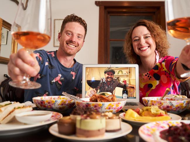 Mark Reynolds and Sarah Heard having virtual dinner with Ben Macmahon at home in Plympton, where theyÕre eating Africola take-away with dessert from, From the Wild, Wednesday, April 1, 2020. Picture: MATT LOXTON