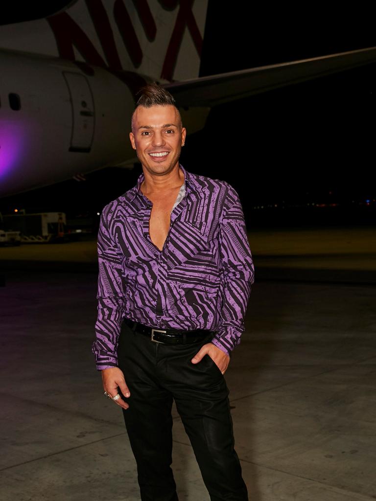 Anthony Callea at the launch of Virgin Australia's new business-class menu in the Virgin hangar at Brisbane Airport. Picture: Carly Ravenhall