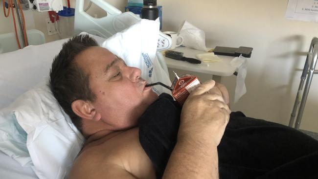 Duane Trouchet having his first iced coffee in hospital. Picture: Supplied