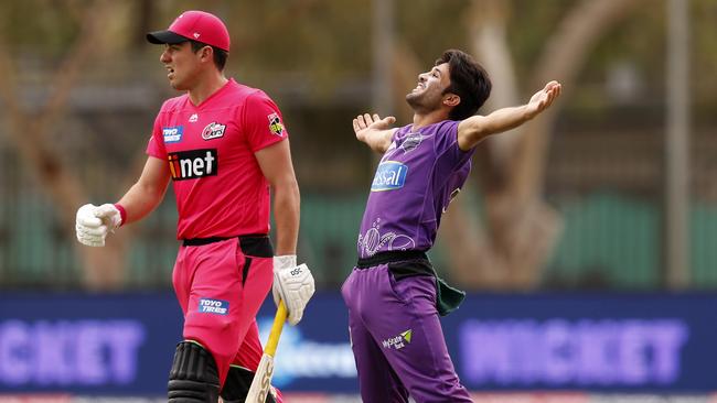 Hurricanes spinner Qais Ahmad celebrates taking the wicket of the Sixers’ Moises Henriques in Alice Springs on Friday. Picture: Getty Images