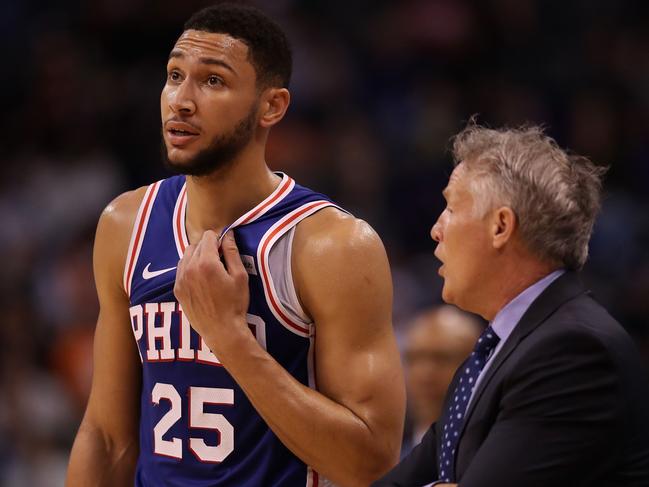 PHOENIX, ARIZONA - NOVEMBER 04: Ben Simmons #25 of the Philadelphia 76ers talks with head coach Brett Brown during the first half of the NBA game against the Phoenix Suns at Talking Stick Resort Arena on November 04, 2019 in Phoenix, Arizona. NOTE TO USER: User expressly acknowledges and agrees that, by downloading and/or using this photograph, user is consenting to the terms and conditions of the Getty Images License Agreement   Christian Petersen/Getty Images/AFP == FOR NEWSPAPERS, INTERNET, TELCOS & TELEVISION USE ONLY ==